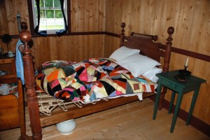 Interior, Factor's House, Historic Dunvegan. Do you remember hearing the saying “Sleep tight” when you were a child?  While it’s not known for sure, many believe that the saying originated with the use of rope beds such as this.  A person would have to tighten the ropes of the bed every so often, otherwise the ropes might loosen and cause the person to fall through to the floor in the middle of the night.  Possibly as a reminder to tighten the ropes, the saying: “Good night, sleep tight” came into being.