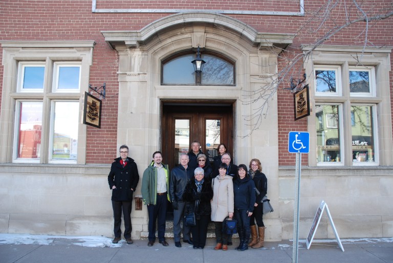 Alberta Main Street Program staff and Coordinators outside the historic Bank of Commerce Building in Olds. 
