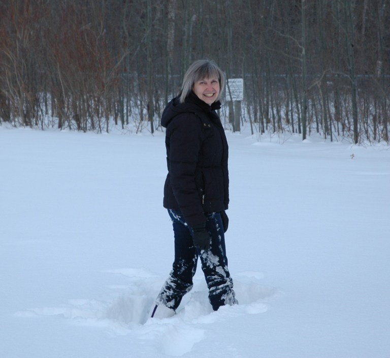 A photograph of Anna Curtis, Head of Land Use Planning, working at a site in the Cypress Hills.