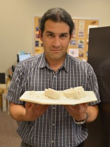 Alireza Farrokhi holding 1:200 scale model of the Big Rock