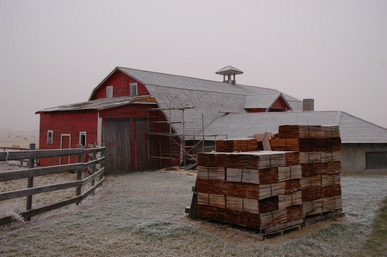 A historic barn in east-central Alberta being re-shingled (2005).