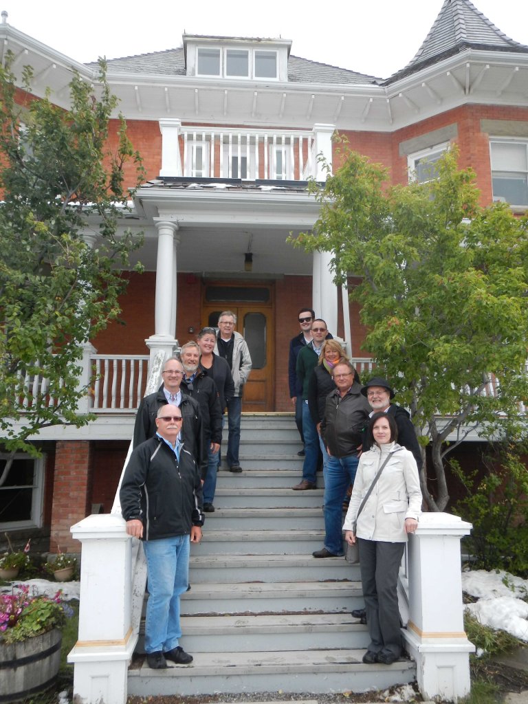 The Board of the Alberta Historical Resources Foundation, on the steps of Lebel Mansion, the Town of Pincher Creek's first designated Municipal HIstoric Resource. 