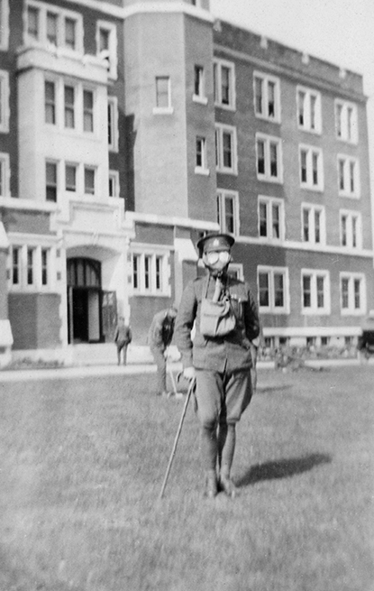 A soldier wearing a gas mask in Front of the Alberta College Building (now Old St. Stephen’s College), ca. 1917.  (City of Edmonton Archives, EA-63-115).