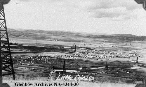 Little Chicago (Royalties), Alberta, 1940. Like Little New York (Longview) to the south, Little Chicago, or Royalties, developed quickly after the 1936 oil strike in Turner Valley. The unofficial name was likely a sarcastic reference to the frantic pace of development at the town site, or a not-so-polite reference to a local shopkeeper. (Glenbow Archives, NA-4344-30).