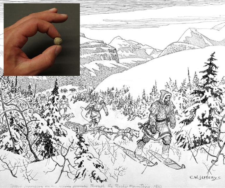 A collection of musket balls found in 1921 (like the one featured in the inset) have been traced back to David Thompson who is featured here crossing Athabasca Pass in the Rocky Mountains by snowshoe in 1810-11. Library and Archives Canada, Acc. No. 1972-26-9.