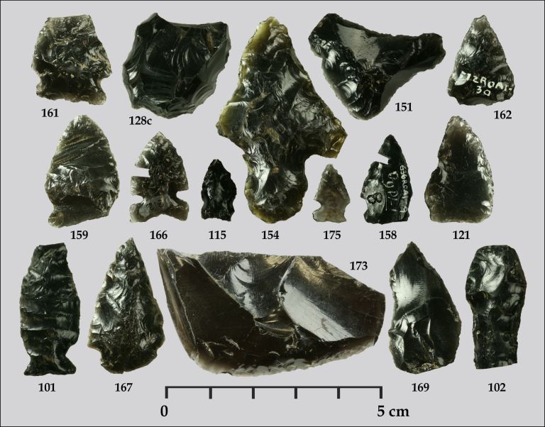These obsidian artifacts were recovered from Waterton, Banff, Jasper, Yoho, and Kootenay National Parks in the Northern Rockies and have been sourced by a team from the University of Georgia and the Royal Alberta Museum back to their volcanic origins using a technique called X-ray fluorescence. Most obsidian along Alberta’s Eastern Slopes is either from Bear Gulch in Idaho, Obsidian Cliffs in Wyoming, or Edziza in northwest British Columbia. This suggests that people of the mountains maintained widespread trade networks. Note that specimens 158 and 166 have small sections cut from them by analysts who attempted to determine how old the projectile points are using a technique called obsidian hydration dating (by Todd Kristensen).