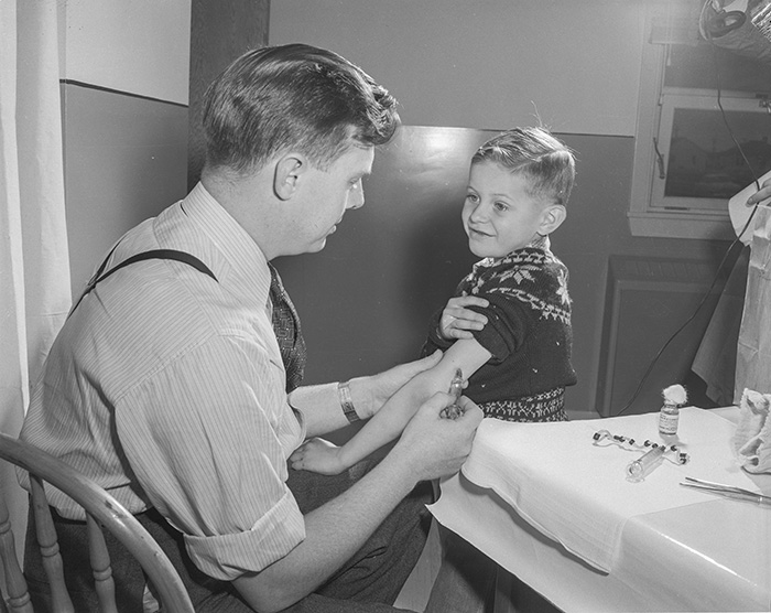 Dr. Ball giving polio vaccinations, Queen Mary Elementary School, 1956. Source: Provincial Archives of Alberta, Photo PA 2887/2.