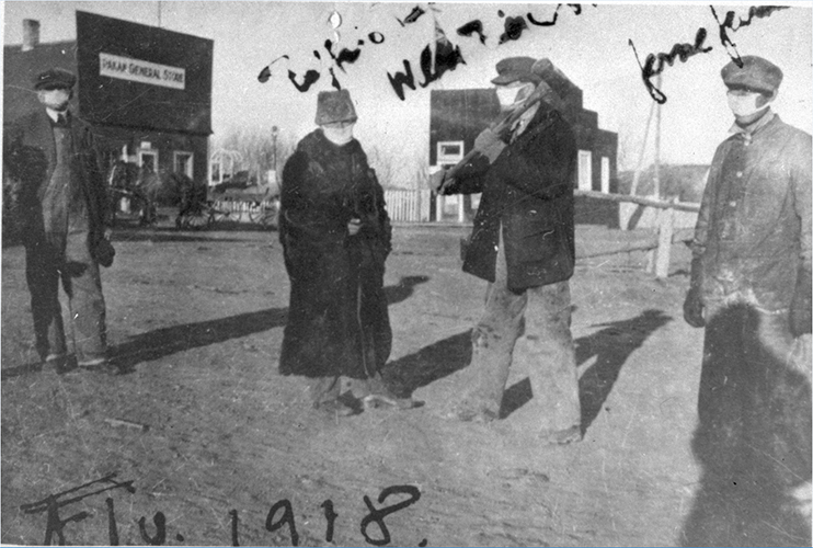 (Above) People by Pakan General Store with masks, 1918. Photo UV6. (Below) School boys and M.J.C. Levason (lay reader) wearing masks because of the 1918 influenza scare, St. Peter's Anglican mission, Lesser Slave Lake.  Photo A14803