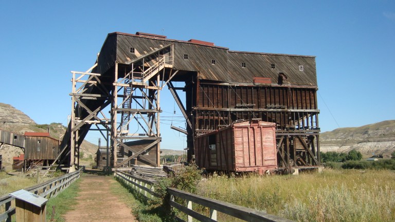 The adaptation of the Atlas No. 3 from a working coal mine to a museum and interpretive site has involved many sensitive changes to allow a contemporary use, while ensuring the heritage values of the historic place are protected. To that end, the recent rehabilitation of the tipple incorporated new galvanized fasteners and fittings as well as new timbers made from high-quality fresh-sawn Douglas fir, discreetly marked with copper tags indicating the year of repair. Source: Historic Resources Management Branch.
