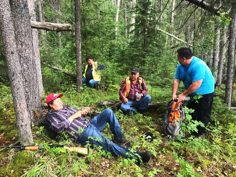 Driftpile Cree Nation members rest at the contemporary lean-to that serves as the halfway point to Drift-Pile Camp.