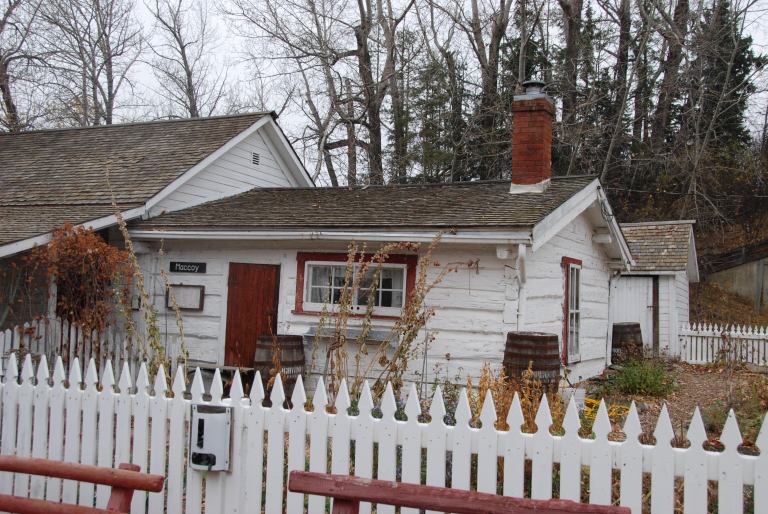 Flood repairs in 2016 included the conservation of a washroom addition, located at the west end of the front porch, as part of a larger program to adapt the porch floor structure to a new foundation. Source: Historic Resources Management Branch.